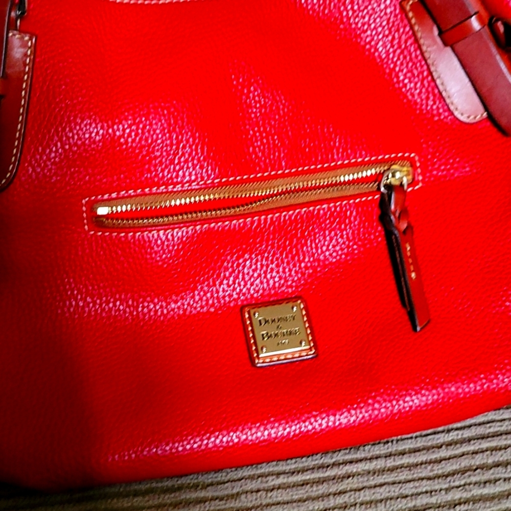 Red leather Dooney and Bourke purse.
